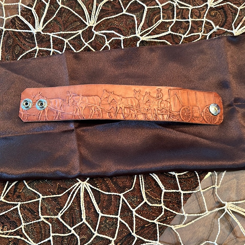 Stamped, genuine leather cuff.